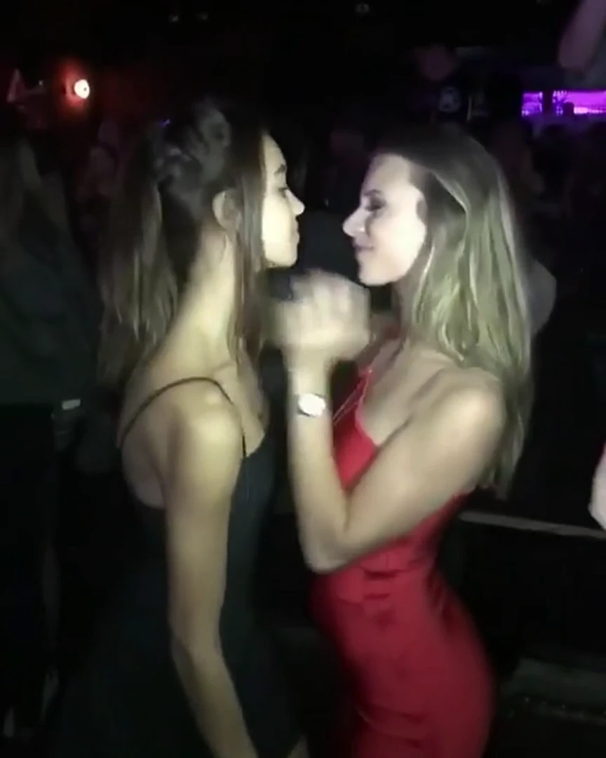 Friends kissing at a party