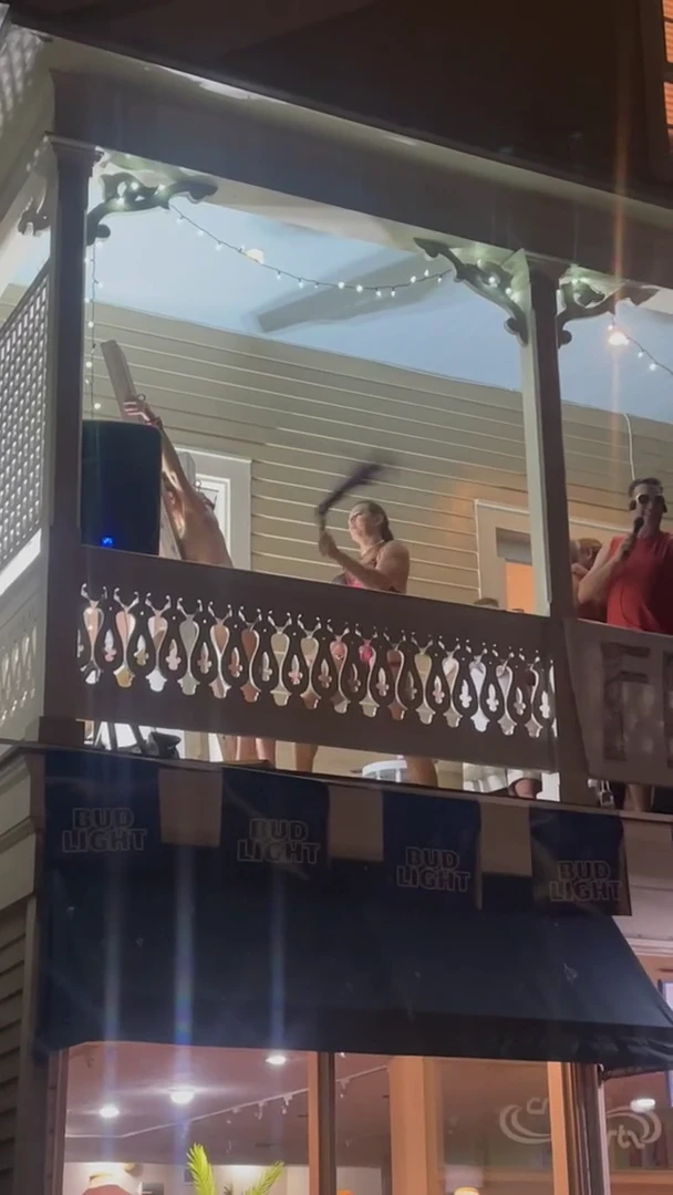 Getting flogged on a balcony at Fantasyfest